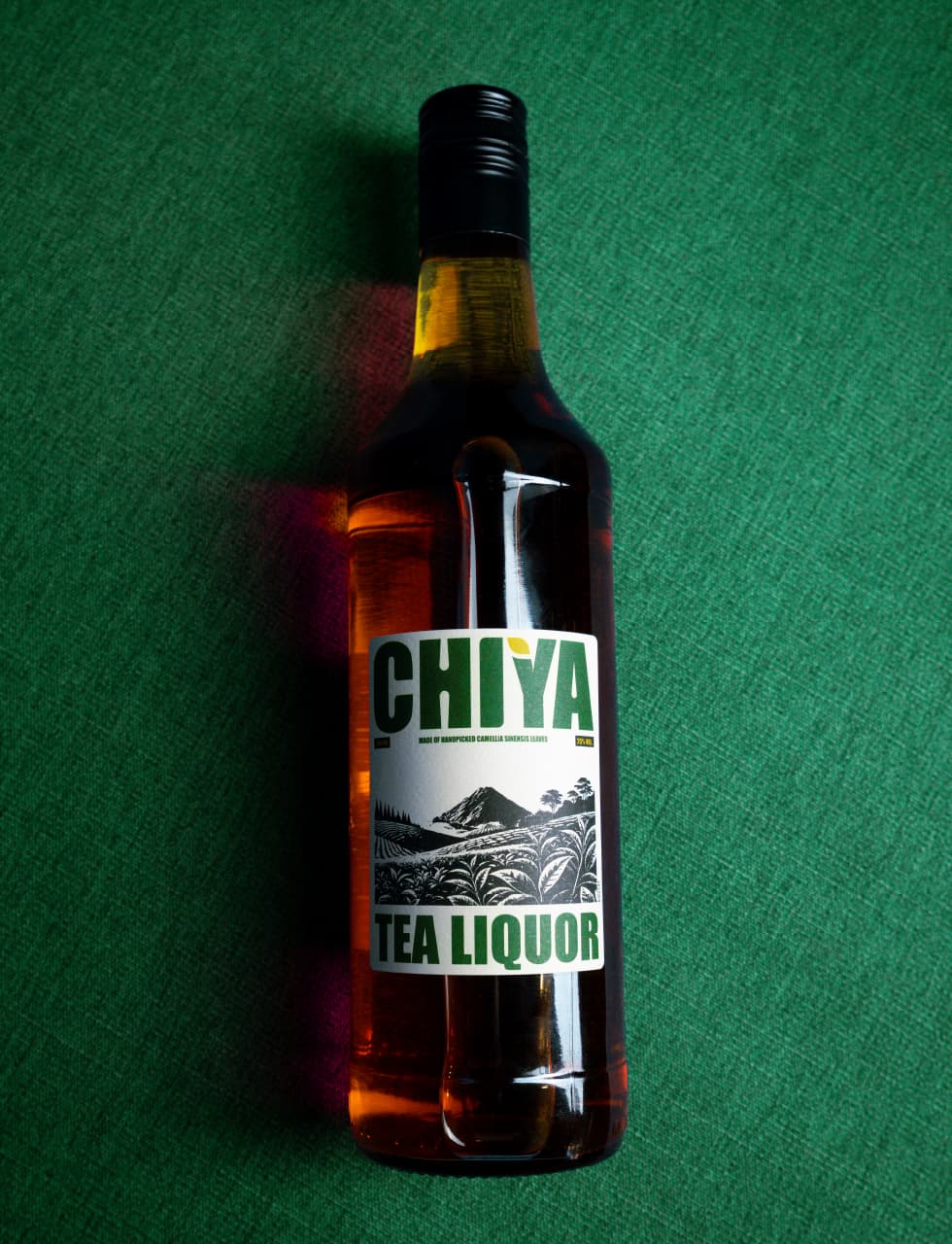 Chiya tea liquor bottle poured over ice in a low glass